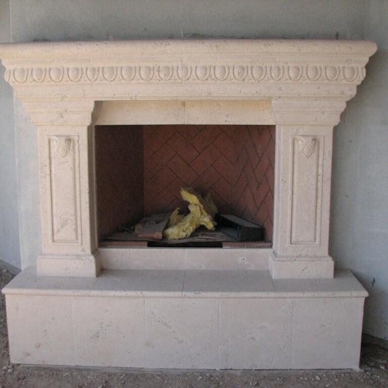 A fireplace in a house with a fireplace mantel.